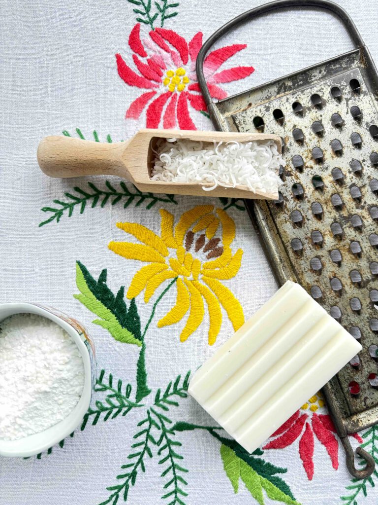 Laundry detergent ingredients with grated soap and vintage grater