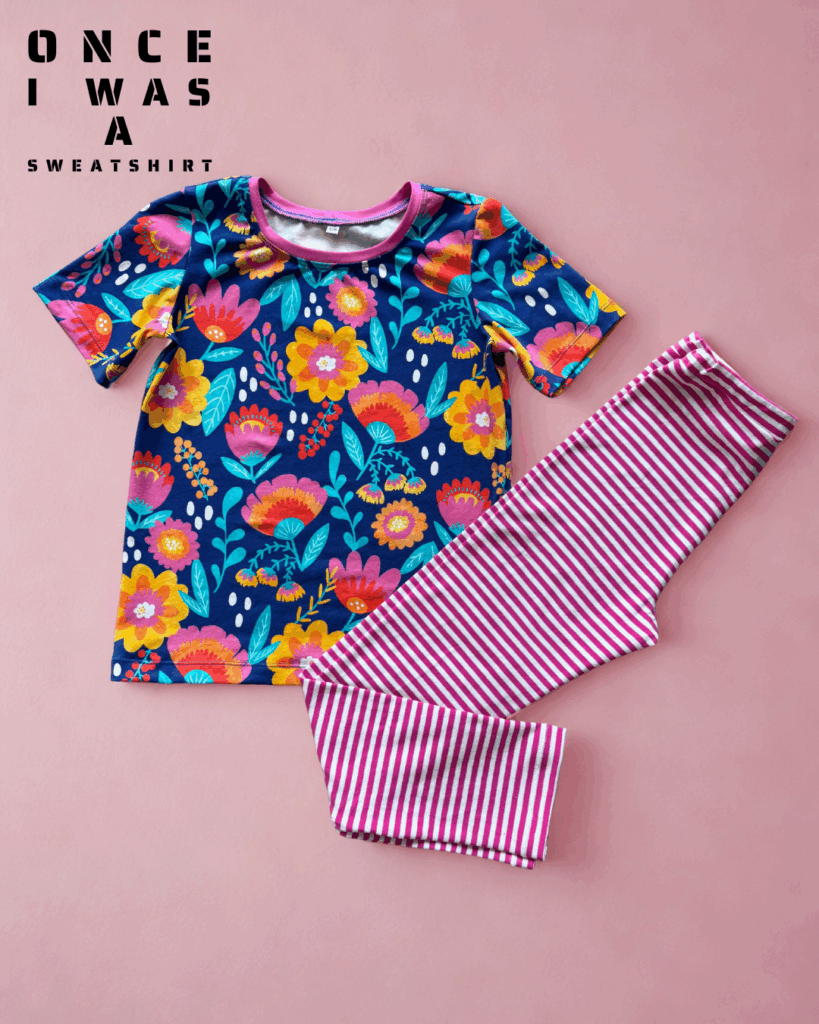 Kids short sleeve top with colorful floral pattern and striped leggings