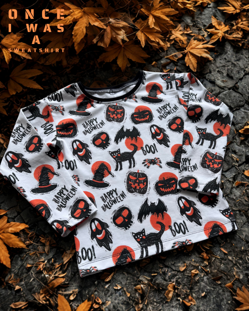 Kids sweatshirt with Halloween pattern featuring pumpkins, ghosts and autumn elements